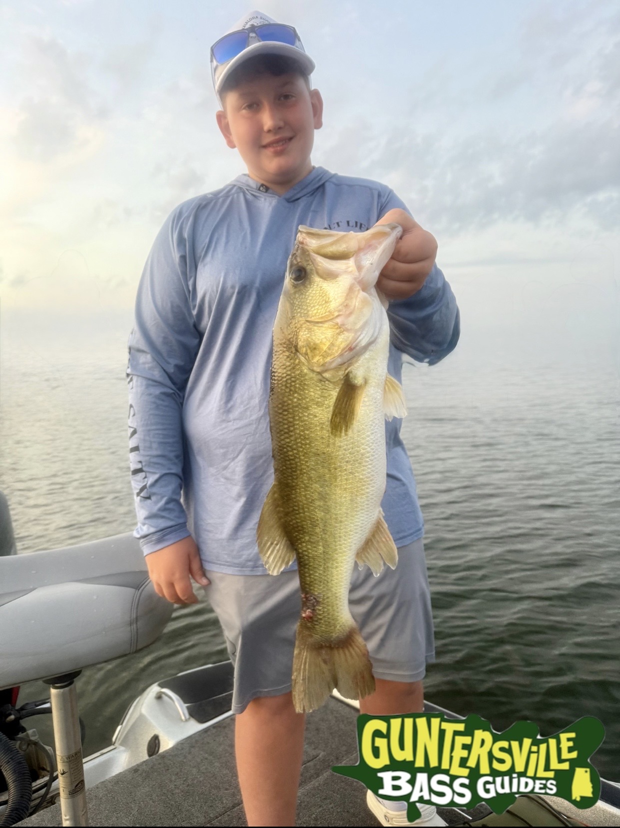 Lake Guntersville guided bass fishing client with largemouth bass