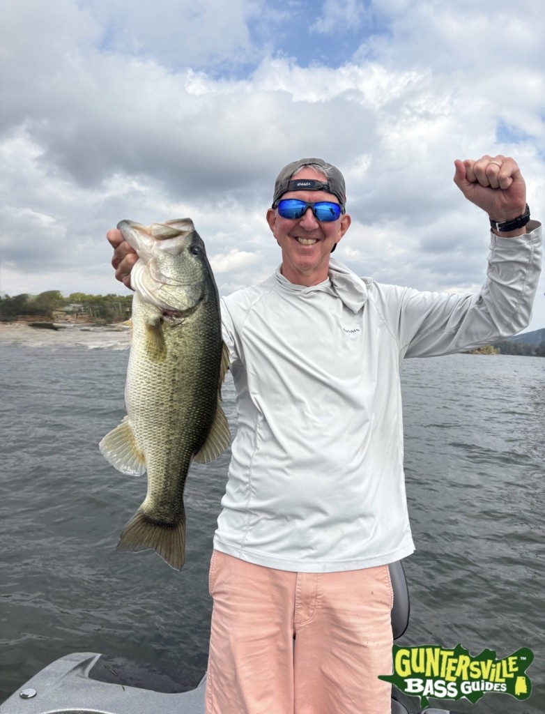 Excited client holding a fish from a guided trip with Captain Myles Murray