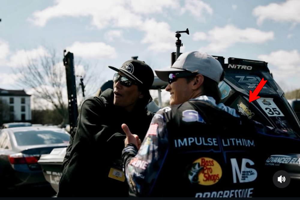 Tucker Smith being interviewed on Media Day in the boatyard with the Guntersville Bass Guides logo visible on the boat