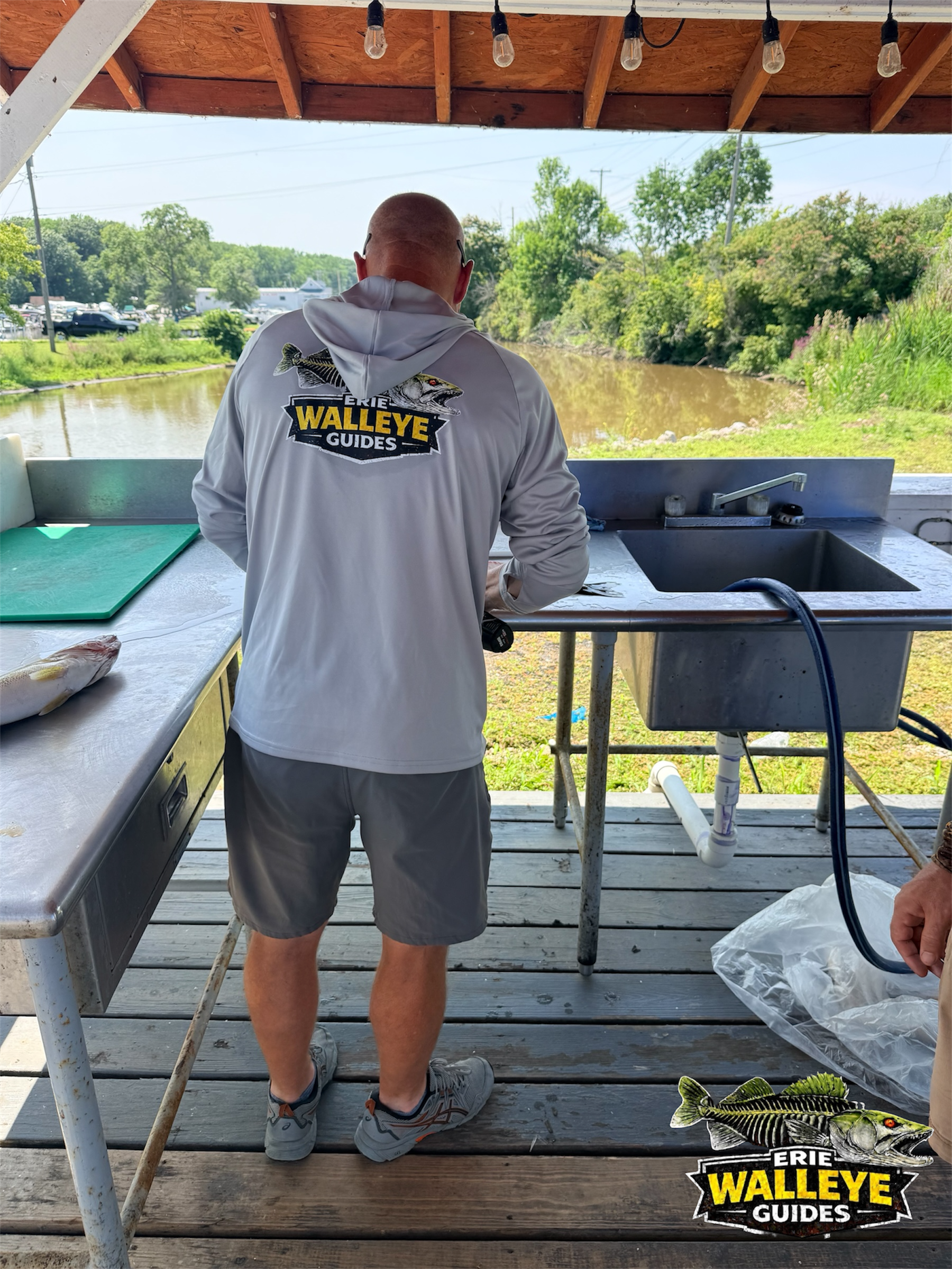 Captain Steve Hatfield cleaning Lake Erie walleyes after a guided trip